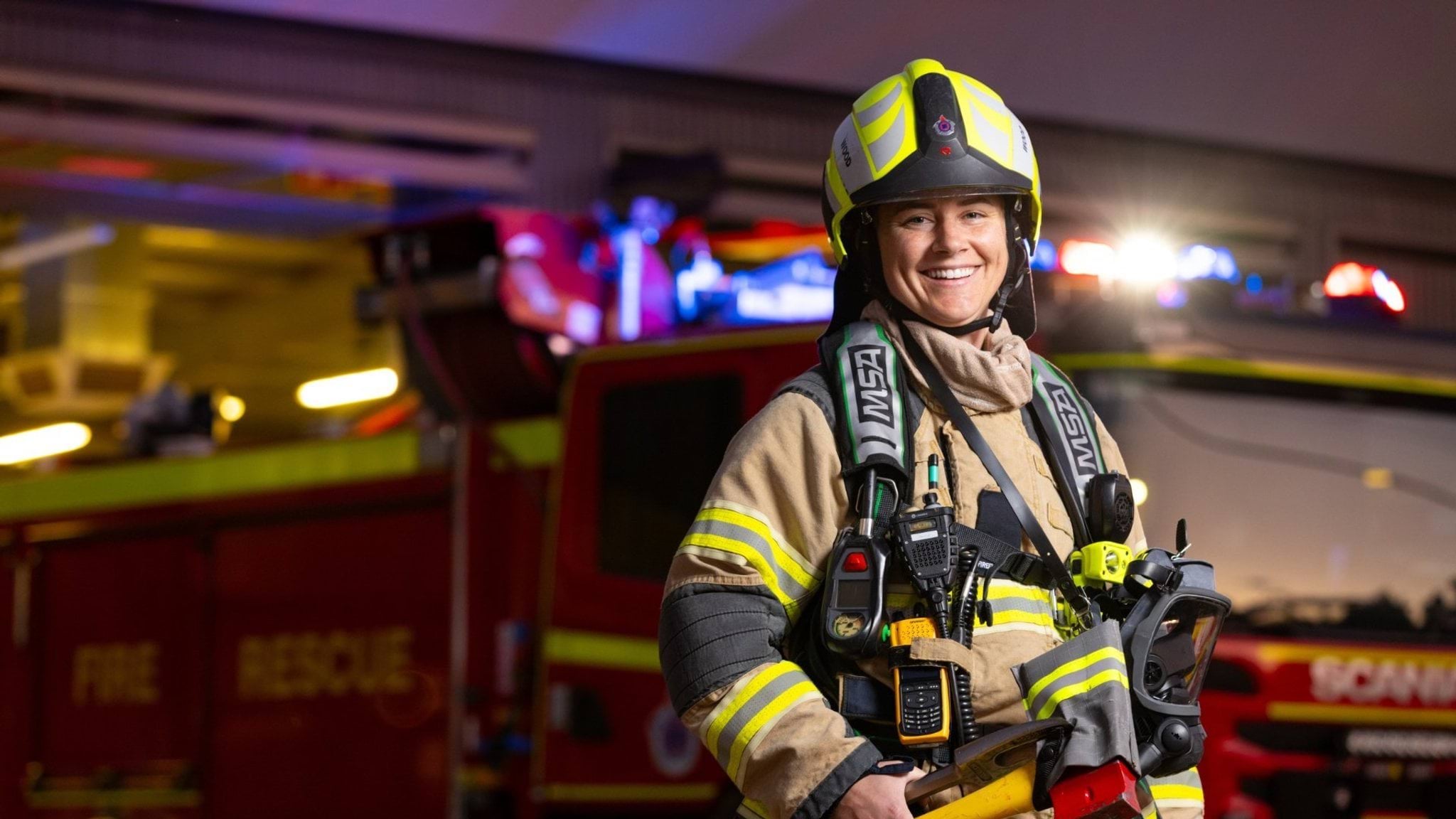 Female firefighter wearing turnout gear
